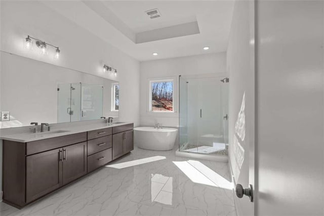 2023 Fern Mountain Ln, Marietta, GA 30064 - bathroom featuring a shower stall, a freestanding tub, and a sink