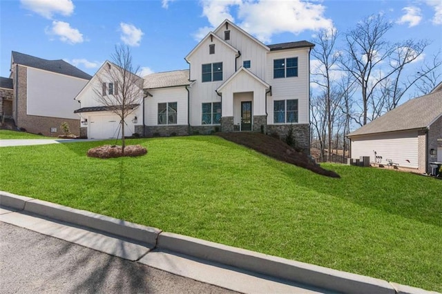 2023 Fern Mountain Ln, Marietta, GA 30064 - view of front facade featuring a front lawn, central AC unit, stone siding, concrete driveway, and board and batten siding