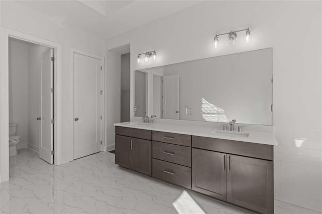 2023 Fern Mountain Ln, Marietta, GA 30064 - full bathroom with marble finish floor, a sink, double vanity, and toilet