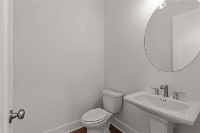 2023 Fern Mountain Ln, Marietta, GA 30064 - bathroom with baseboards, toilet, and a sink