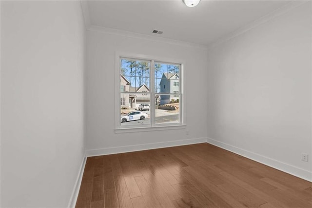 2023 Fern Mountain Ln, Marietta, GA 30064 - unfurnished room with wood finished floors, visible vents, crown molding, and baseboards
