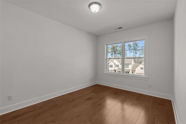 2023 Fern Mountain Ln, Marietta, GA 30064 - unfurnished room featuring baseboards, visible vents, and dark wood-type flooring