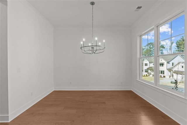 2023 Fern Mountain Ln, Marietta, GA 30064 - unfurnished dining area featuring crown molding, a notable chandelier, and a healthy amount of sunlight