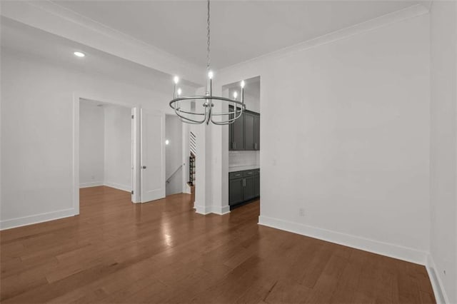 2023 Fern Mountain Ln, Marietta, GA 30064 - unfurnished dining area with dark wood finished floors, an inviting chandelier, and baseboards