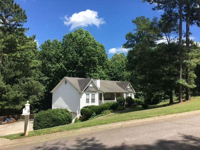 view of property exterior with a yard