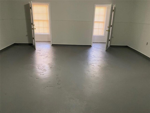 229 Smithstone Path, Fayetteville, GA 30214 - unfurnished room featuring concrete floors and plenty of natural light