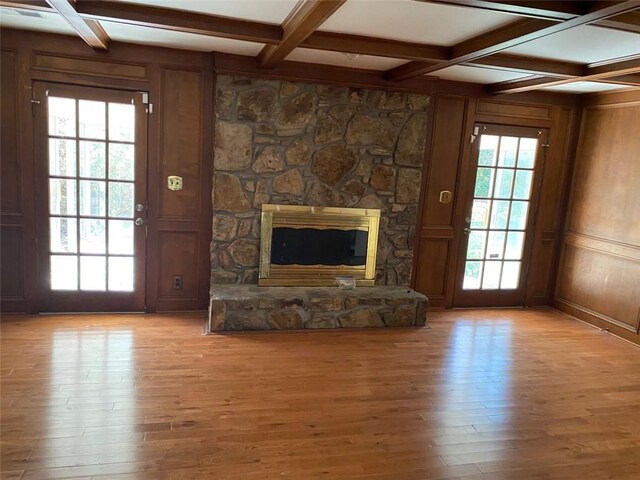 229 Smithstone Path, Fayetteville, GA 30214 - unfurnished living room featuring a stone fireplace, coffered ceiling, light wood-style flooring, and beam ceiling