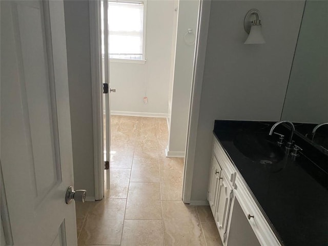 229 Smithstone Path, Fayetteville, GA 30214 - bathroom with tile patterned floors, vanity, and baseboards
