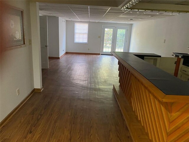 229 Smithstone Path, Fayetteville, GA 30214 - corridor featuring baseboards, dark wood finished floors, a drop ceiling, and french doors