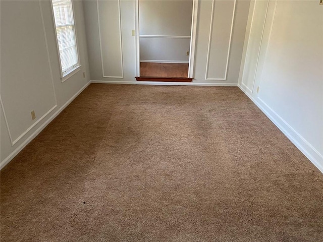 229 Smithstone Path, Fayetteville, GA 30214 - unfurnished bedroom featuring carpet and a decorative wall