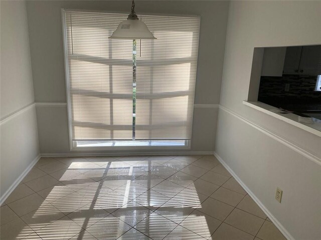 229 Smithstone Path, Fayetteville, GA 30214 - unfurnished dining area featuring baseboards and light tile patterned floors