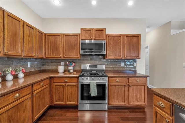812 Roget Way, Lawrenceville, GA 30045 - kitchen featuring appliances with stainless steel finishes, backsplash, dark wood-style floors, brown cabinets, and recessed lighting
