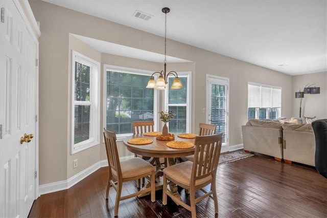 812 Roget Way, Lawrenceville, GA 30045 - dining room with baseboards, dark wood-type flooring, and a chandelier