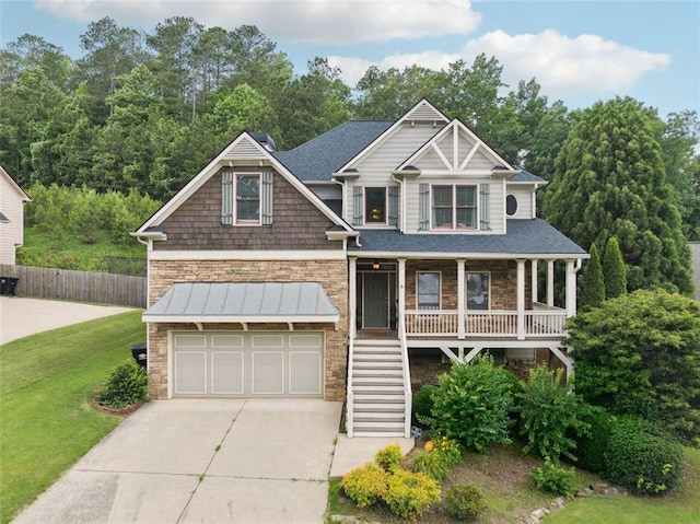 402 Homestead Dr, Dallas, GA 30157 - view of front of property with stone siding, an attached garage, concrete driveway, covered porch, and stairway