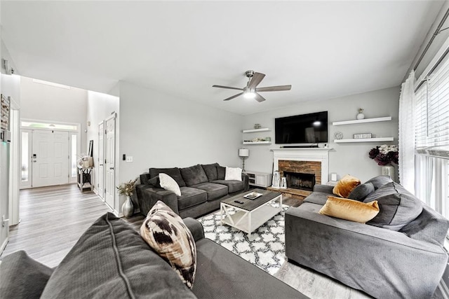 402 Homestead Dr, Dallas, GA 30157 - living area with wood finished floors, ceiling fan, and a fireplace