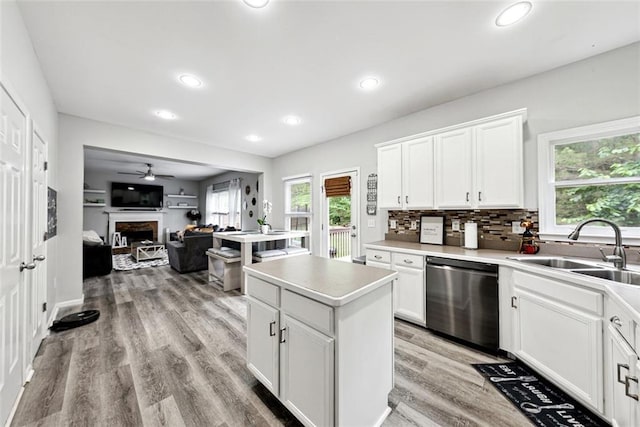 402 Homestead Dr, Dallas, GA 30157 - kitchen featuring dishwasher, plenty of natural light, a fireplace, light wood-style flooring, and recessed lighting