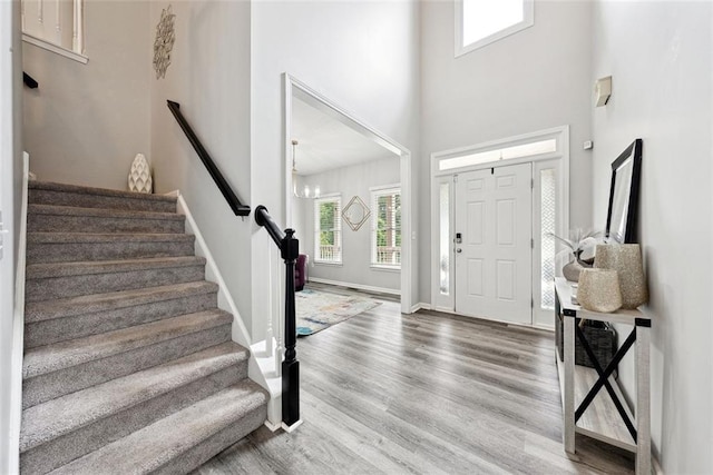 402 Homestead Dr, Dallas, GA 30157 - foyer featuring wood finished floors, stairway, and a towering ceiling