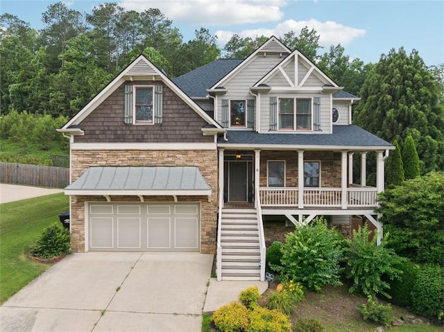 402 Homestead Dr, Dallas, GA 30157 - view of front facade with stone siding, stairs, concrete driveway, covered porch, and a garage