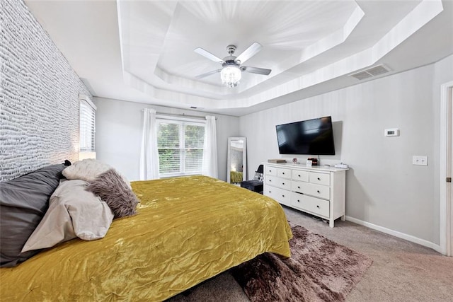 402 Homestead Dr, Dallas, GA 30157 - bedroom with carpet floors, a tray ceiling, and a ceiling fan