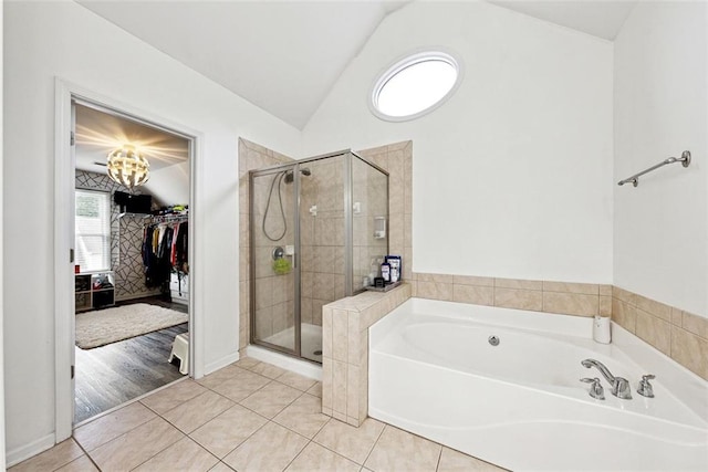 402 Homestead Dr, Dallas, GA 30157 - full bathroom with a garden tub, a shower stall, vaulted ceiling, a spacious closet, and tile patterned floors