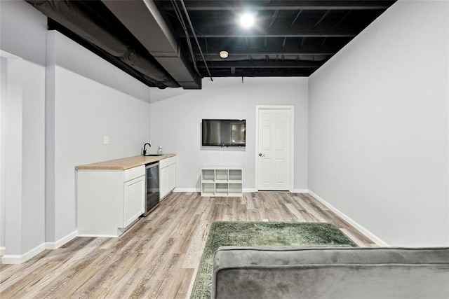 402 Homestead Dr, Dallas, GA 30157 - indoor wet bar with light wood-type flooring and beverage cooler