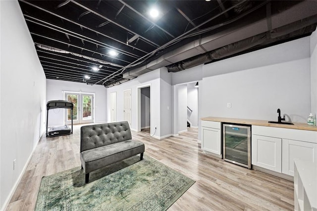402 Homestead Dr, Dallas, GA 30157 - indoor wet bar featuring beverage cooler, light wood finished floors, and stairway