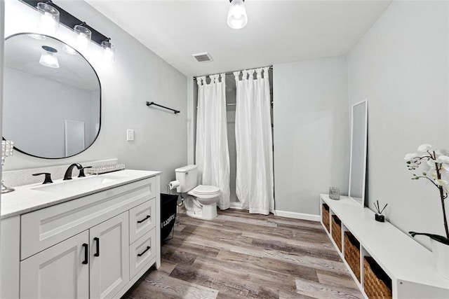 402 Homestead Dr, Dallas, GA 30157 - bathroom featuring vanity, wood finished floors, and a shower with curtain