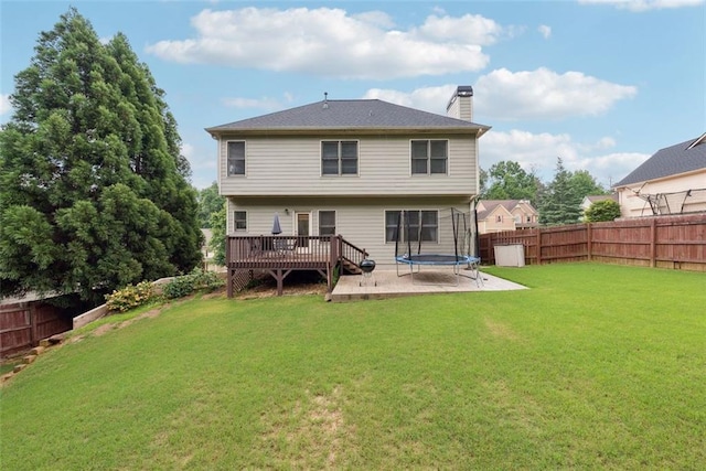 402 Homestead Dr, Dallas, GA 30157 - back of house featuring a trampoline, a wooden deck, a fenced backyard, and a chimney