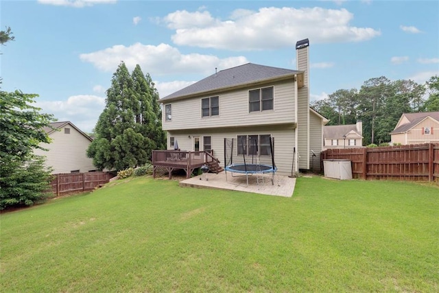 402 Homestead Dr, Dallas, GA 30157 - rear view of property with a fenced backyard, a wooden deck, a chimney, and a trampoline