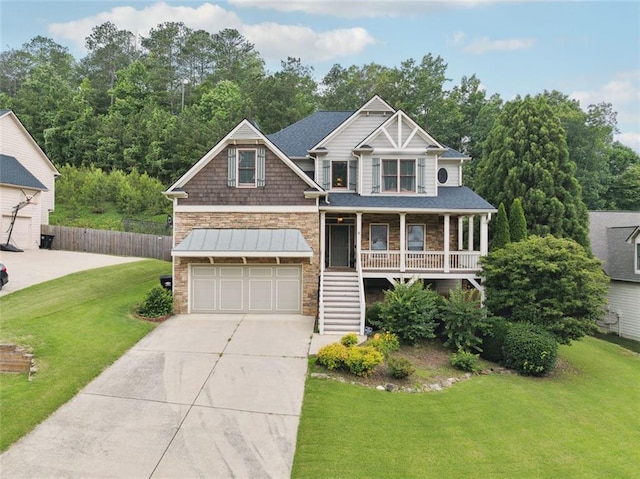 402 Homestead Dr, Dallas, GA 30157 - view of front of property with stone siding, covered porch, driveway, stairs, and an attached garage