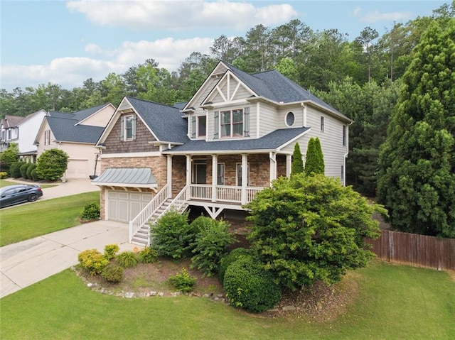 402 Homestead Dr, Dallas, GA 30157 - view of front of home featuring driveway, stone siding, and covered porch