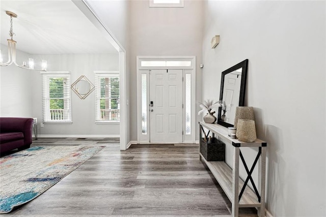 402 Homestead Dr, Dallas, GA 30157 - entryway with wood finished floors and a chandelier