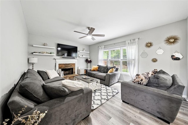 402 Homestead Dr, Dallas, GA 30157 - living room with wood finished floors, ceiling fan, and a fireplace