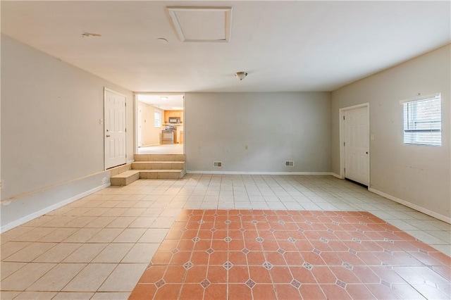 spare room featuring light tile patterned floors