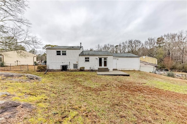 rear view of property with french doors, a patio, a lawn, and central air condition unit