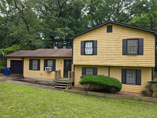 234 Park Place Dr, Lawrenceville, GA 30046 - split level home featuring a garage, a front lawn, concrete driveway, and view of scattered trees