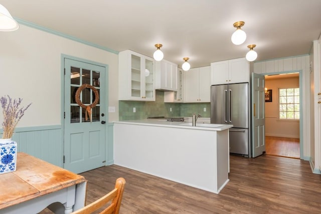 6795 Brandon Mill Rd, Atlanta, GA 30328 - kitchen with high quality fridge, glass insert cabinets, a peninsula, white cabinetry, and a wainscoted wall