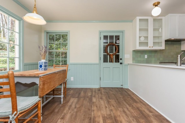 6795 Brandon Mill Rd, Atlanta, GA 30328 - dining room featuring wainscoting, dark wood-style flooring, healthy amount of natural light, and ornamental molding