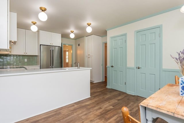 6795 Brandon Mill Rd, Atlanta, GA 30328 - kitchen with high end refrigerator, decorative backsplash, white cabinets, dark wood-style floors, and a peninsula