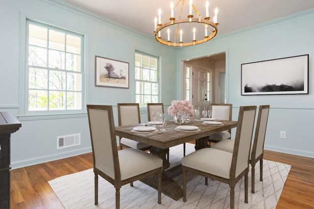 6795 Brandon Mill Rd, Atlanta, GA 30328 - dining space featuring a chandelier, plenty of natural light, wood finished floors, and crown molding