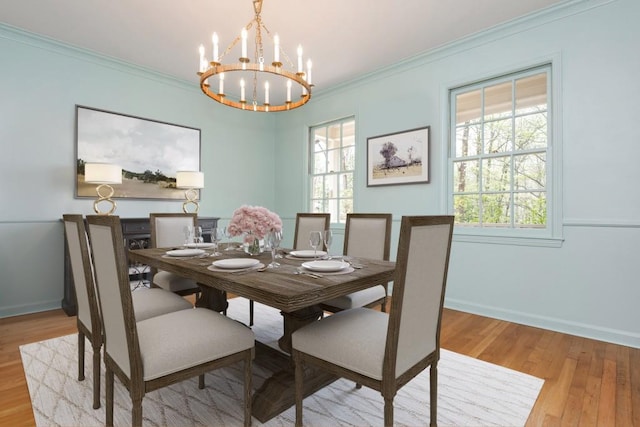 6795 Brandon Mill Rd, Atlanta, GA 30328 - dining room with a chandelier, light wood finished floors, baseboards, crown molding, and plenty of natural light