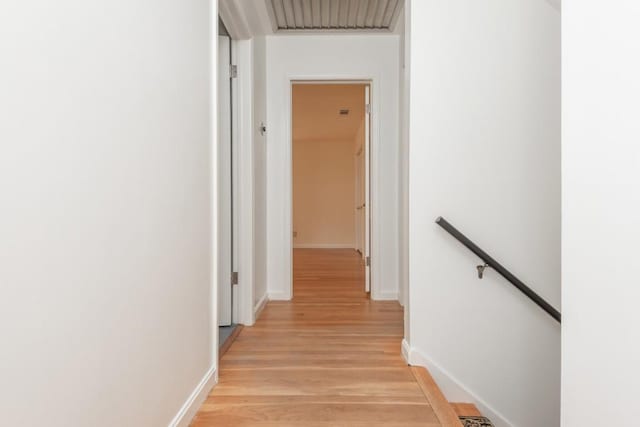 6795 Brandon Mill Rd, Atlanta, GA 30328 - corridor with an upstairs landing, light wood finished floors, and baseboards