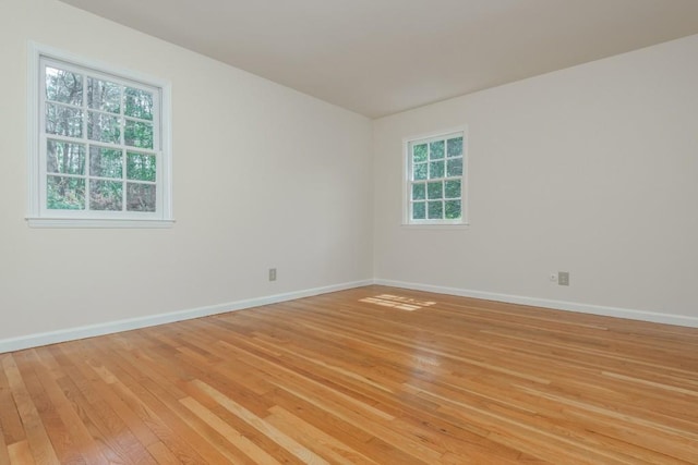 6795 Brandon Mill Rd, Atlanta, GA 30328 - unfurnished room with light wood-type flooring, healthy amount of natural light, and baseboards