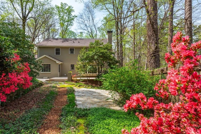 6795 Brandon Mill Rd, Atlanta, GA 30328 - back of property featuring a chimney, a wooden deck, and a patio area
