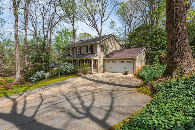 6795 Brandon Mill Rd, Atlanta, GA 30328 - view of front facade featuring asphalt driveway and an attached garage