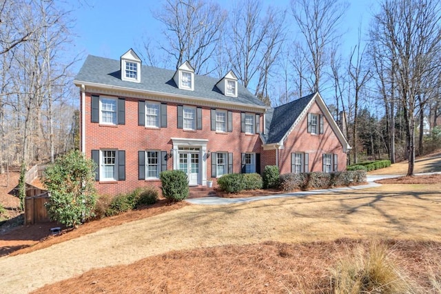 view of front of house with brick siding