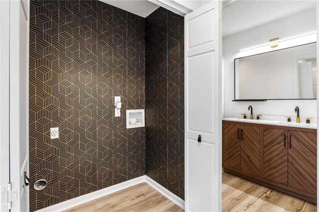 bathroom featuring hardwood / wood-style floors and vanity