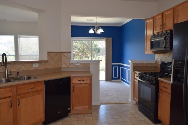 2955 Briaroak Dr, Duluth, GA 30096 - kitchen with black appliances, a sink, light countertops, a chandelier, and backsplash