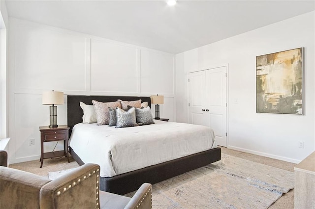 bedroom featuring light colored carpet