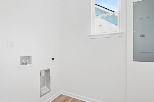 washroom featuring electric dryer hookup, washer hookup, wood-type flooring, and electric panel